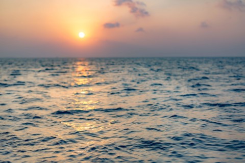 Sea on beautiful sunset, seascape. Vivid twilight sunset sky and motion blur of the sea under with long exposure effect.