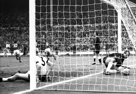 England versus West Germany 1966 World Cup Final, Wembley Stadium England's Martin Peters turns to celebrate his 18th minute goal with Geoff Hurst and Roger Hunt as West Germany's Hans Tilkowski picks...