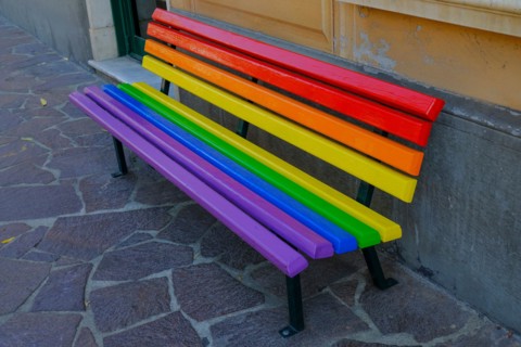 colorful rainbow bench in the park close-up. LGBTQ in the city concept. Social concept