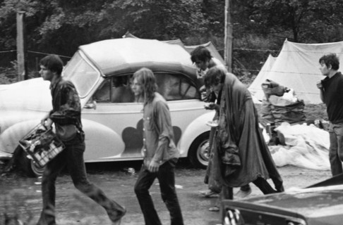 People walk in the rain during the Woodstock Music Festival in Bethel, NY; 1969.