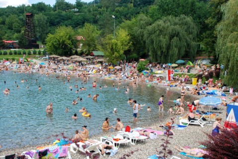 Tuzla, Bosnia and Herzegovina: Pannonian Lakes Complex. Overcrowded open swimming pools during peak of tourist season. Many swimmers in water.