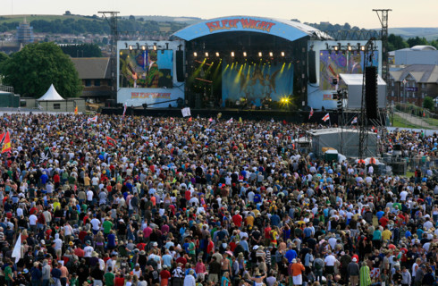 Crowds gather around the main stage at the 2008 Isle of Wight Festival in Newport on the Isle of Wight.