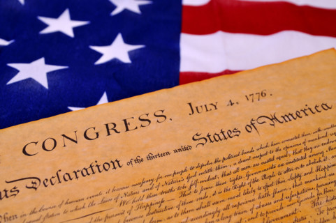 Declaration of Independence with United States flag background