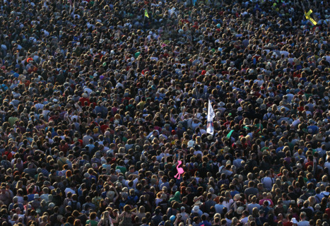 Festival-goers crowd around a stage to watch Pulp perform at The Glastonbury Festival in England 2011