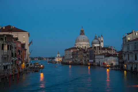 Twilight on the Grand Canal looking toward the Basilica of Santa Maria Della Salute from the Accademia Bridge in Venice.