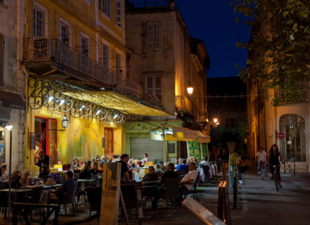 Café Van Gogh in Arles, Provence-Alpes-Cote d'Azur, France - September 15, 2010: Warm summer evening in café at the Place du Forum