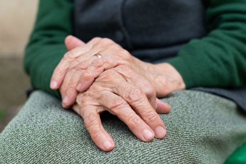 Close up picture of elderly hands of a widowed woman