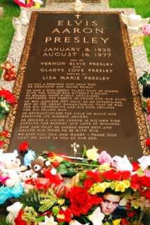 The Grave of rock n roll singer and entertainer Elvis Presley, is surrounded by offerings and gifts on his estate in Graceland, Memphis, Tennessee