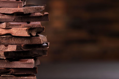 chocolate tower of dark chocolate bars, dessert food
