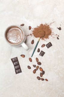 Cocoa in different presentations, hot drink, beans, powder and chocolate bar