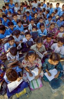 India, Rajasthan, primary school class having lessons outside between Jodhpur and Jaipur.