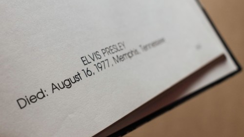 Close-up of 'Elvis Presley' text, showing date and place of death.