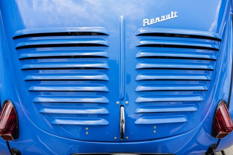 LINTHE, GERMANY - JUNE 08, 2025: Rear detail of a Renault 4CV (1954–1961), engine cover with vents and Renault script badge. Die Oldtimer Show.
