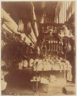 A poultry vendor at Les Halles in Paris, by Eugène Atget, a French photographer, between 1899 and 1924.