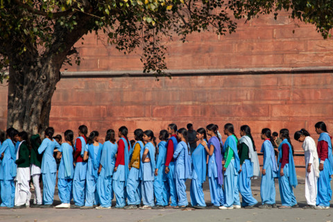 Muslim teenager girls wearing blue school uniforms in Old Delhi, India