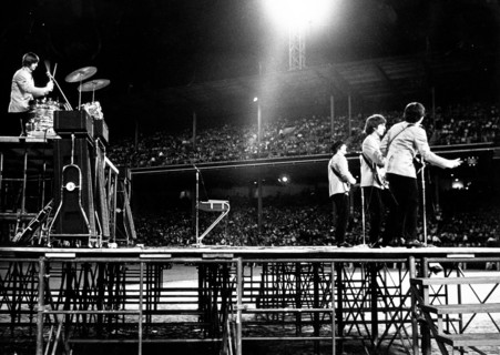 The Beatles perform at Shea Stadium