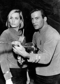 William Shatner and Sally Kellerman, two iconic actors, appear together in a promotional image from the 1966 Star Trek series. Shatner famously portrayed Captain James T. Kirk, while Kellerman appeare...
