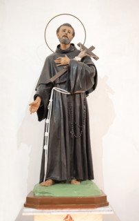 Religious Statue of Saint Francis of Assisi, patron saint of animals and nature and founder of the Franciscan Order over a white background
