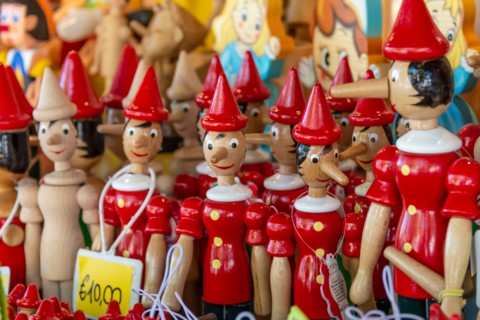 Wooden figurines depicting the character of Pinocchio in Collodi, Italy