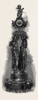 TWO FEMALE FIGURES HOLDING A CLOCK, BY THE COMPAGNIE DES MARBRES ONYX D'ALGERIE, EXHIBITED BY G.