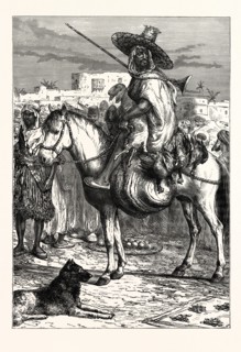 AN ARAB MERCHANT AT TLEMCEN, ALGERIA