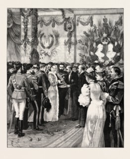 THE ROYAL HOME-COMING AT BUCHAREST: THE MAYOR OFFERING BREAD AND SALT AT THE RAILWAY STATION,