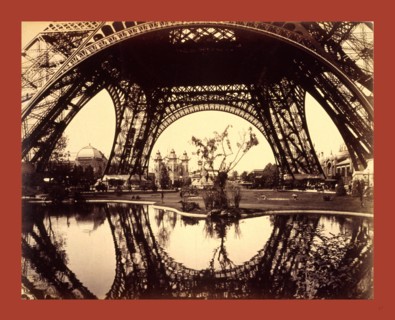 Exhibit buildings and grounds seen through the lower part of the Eiffel Tower, Paris Exposition,