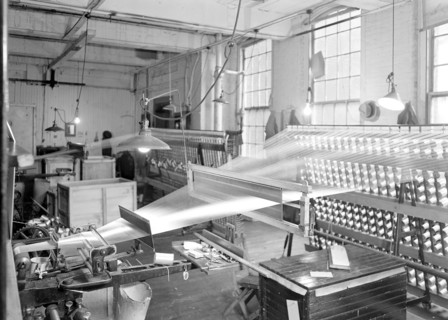 Paterson, New Jersey - Textiles. View of threads going from creel throug the reeds and over the