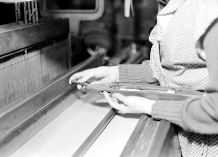 Paterson, New Jersey - Textiles. Weaver threading shuttle, March 1937, Lewis Hine, 1874 - 1940, was