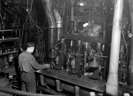 Millville, New Jersey - Glass bottles. Whitall Tatum Co. Second shot of a worker taking a bottle of