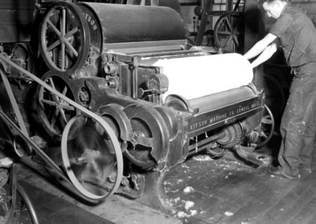 Millville, New Jersey - Textiles. Millville Manufacturing Co. [Man rolling fabric.], 1936, Lewis