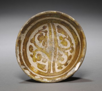 Bowl, 11th Century. Egypt (Fustat), Fatimid Period. Earthenware with luster-painted design;