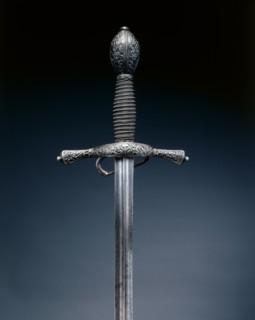 Rapier, c. 1600. Italy, early 17th Century. Steel, wire grip; hilt blued and chiseled with foliate