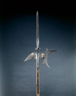 Halberd, c. 1600-1625. France, early 17th century. Steel, pierced; appliqué masks in brass;
