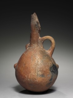 Jug, c. 2000-1800 BC. Cyprus, Early Cypriot III-Middle Cypriot I. Red ware; diameter: 12.5 cm (4