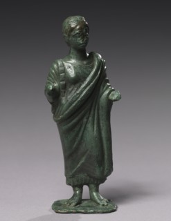 Statuette of Sacrificing Woman, 600-480 BC. Italy, Etruscan, Archaic period. Bronze; overall: 19.1