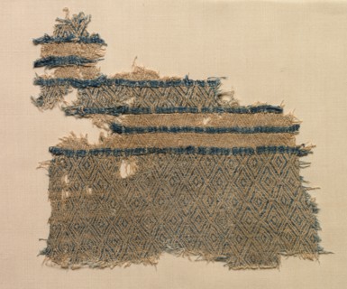 Fragment of linen damask with diamond designs in bands, probably 1000s. Egypt, Fatimid period.