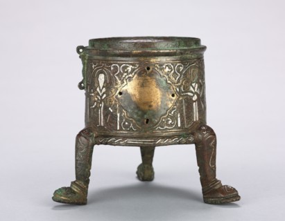 Incense Burner, 1st half 1200s. Syria, Ayyubid Period, 13th Century. Brass inlaid with silver;
