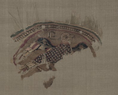 Fragmentary roundel with eagle in gold ground, 1000s. Egypt, Fatimid period. Plain weave with