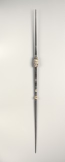 Spindle, c. 1st-3rd century. Peru, South Coast, Nasca style, early period. Wood with carved clay