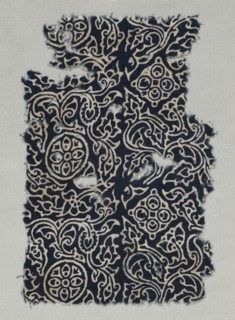 Fragment, 1400s (?). India, 15th century (?). Stamped resist, dyed; cotton; overall: 24.8 x 16.5 cm