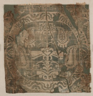 Roundel with angular palmette tree, from a tunic, 650-850. Egypt or possibly Syria. Samite: silk;