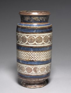 Albarello, c. 1400-1420. Spain, Manises, 15th century. Tin-glazed earthenware, brown lustre;