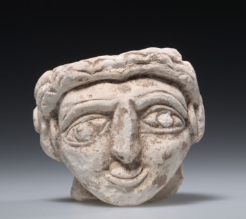 Female Head, 400s. Egypt, Coptic period, 5th Century. Limestone; overall: 9 x 10.2 cm (3 9/16 x 4