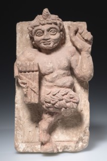 Dancing Pan, c. 350-500. Egypt, Coptic period. Limestone with traces of red polychromy; overall: 34