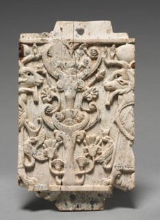Decorative Plaque: Ram-Headed Sphinxes Flanking a Sacred Tree, 900-800 BC. Phoenician, Iraq,