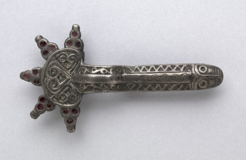 Fibula, 500s. Frankish, Migration period, 6th century. Silver with garnets; overall: 11 x 6 x 1.6