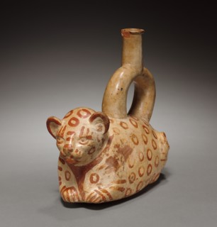 Stirrup Spouted Vessel of Feline Form, 1st millenium. Peru, Mochica. Red earthenware decorated with