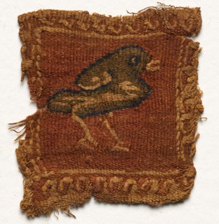 Fragment with Roundel and Decorative Stripes, 600s - 700s. Egypt, Umayyad period, 7th - 8th century