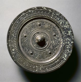 Mirror with Concentric Circles, an Immortal, and Auspicious Animals, 1st century BC-1st century AD.